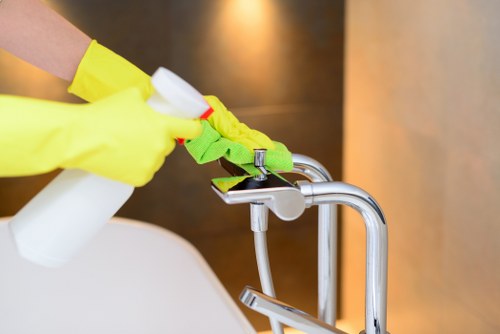 Cleaning staff mopping staircase in a communal area